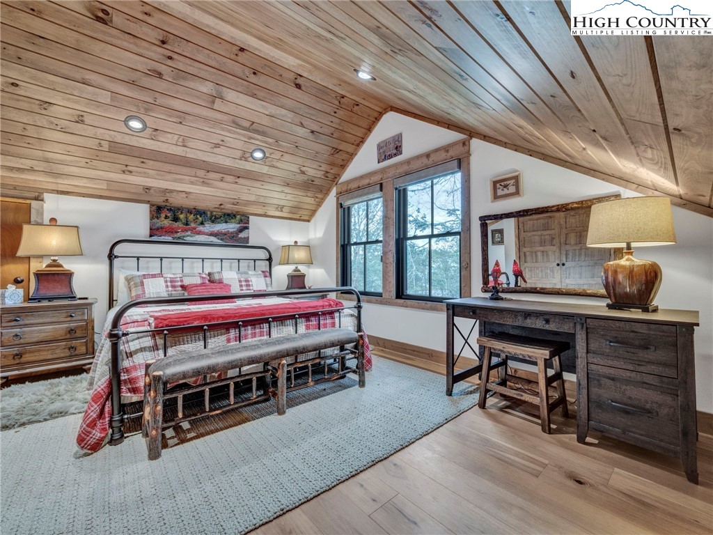 137 Green Cliffs Road Sugar Mountain, NC 28604 - Photo 33 of 48 a bedroom with furniture and a window