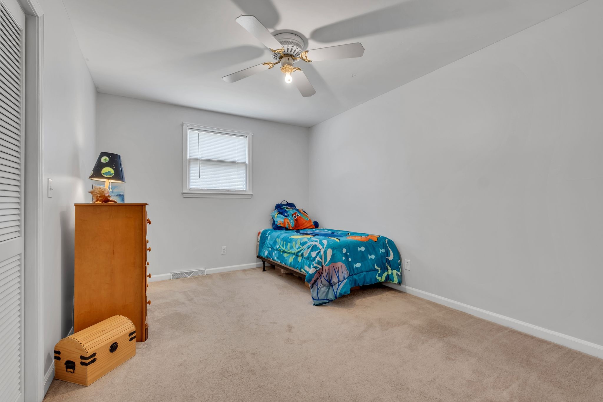 1708 Indian Hills Road Lebanon, TN 37087 - Photo 19 of 34 a bedroom with a bed and a chandelier