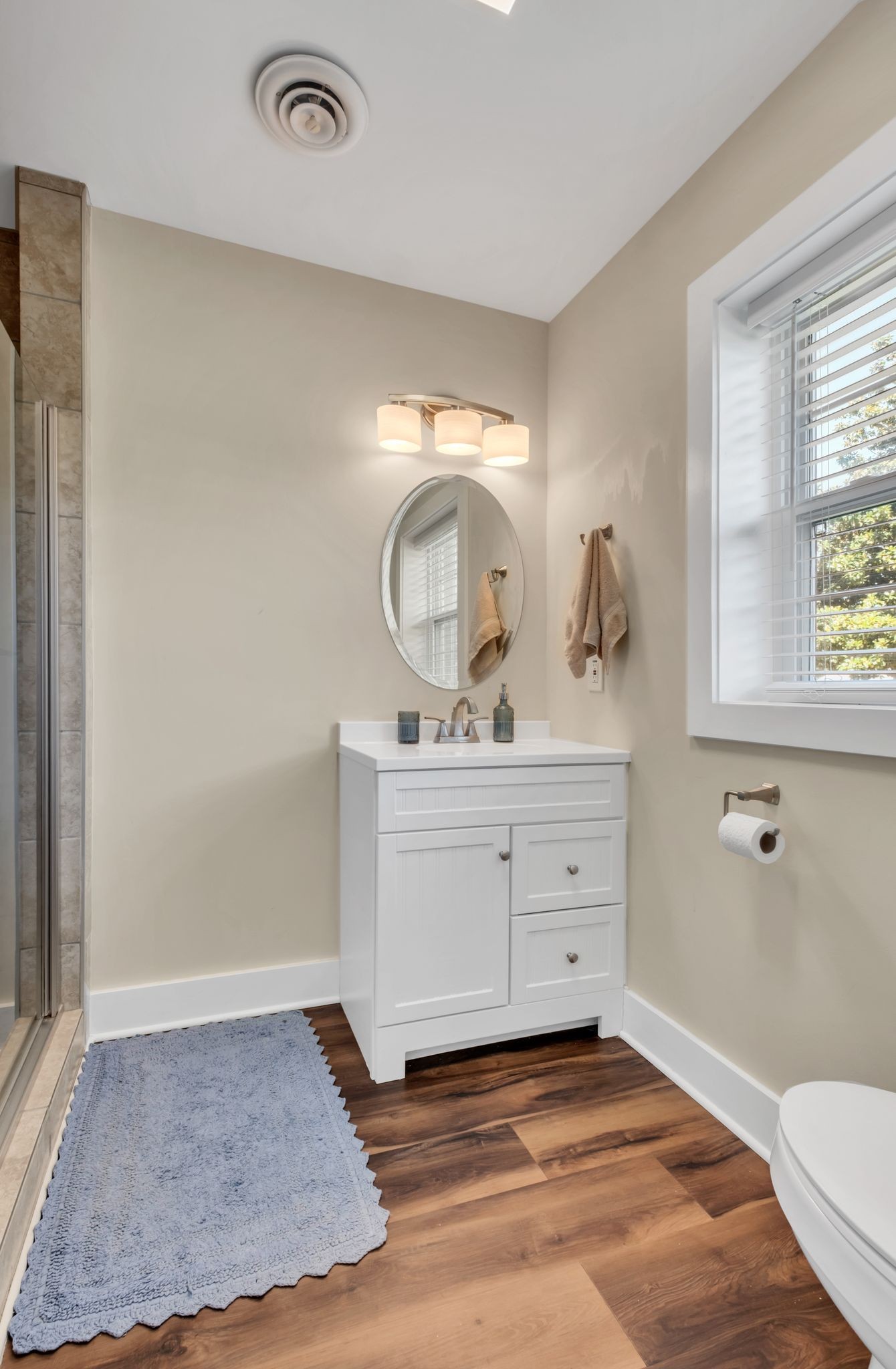 1708 Indian Hills Road Lebanon, TN 37087 - Photo 24 of 34 a bathroom with a sink a toilet and a window
