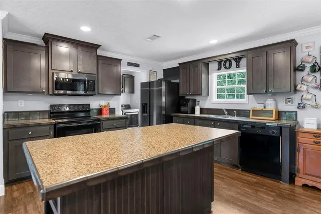 a view of balcony with wooden floor and fence