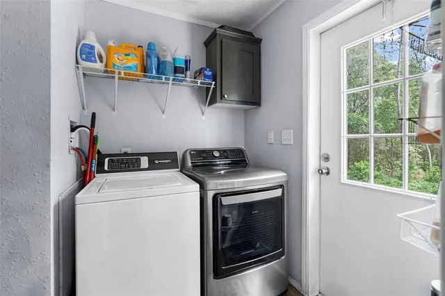 a bathroom with a granite countertop toilet sink and mirror
