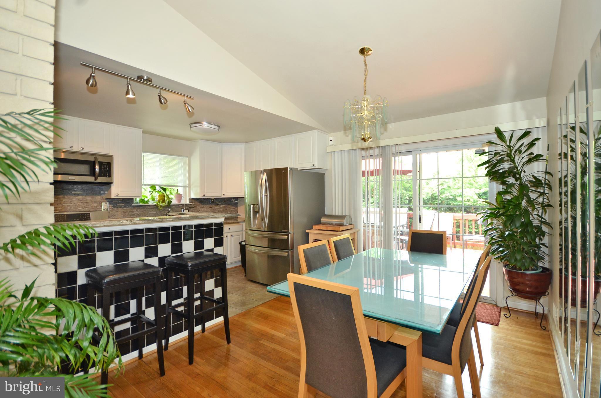 11204 Bybee Street Silver Spring, MD 20902 - Photo 4 of 24 DINING ROOM TO LARGE DECK OVERLOOKING GARDENS