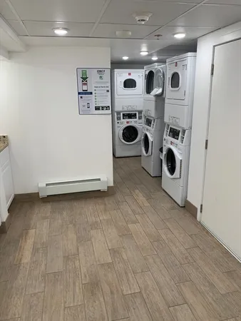 a kitchen with stainless steel appliances a refrigerator and a stove top oven
