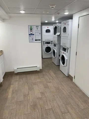 a kitchen with stainless steel appliances a refrigerator and a stove top oven