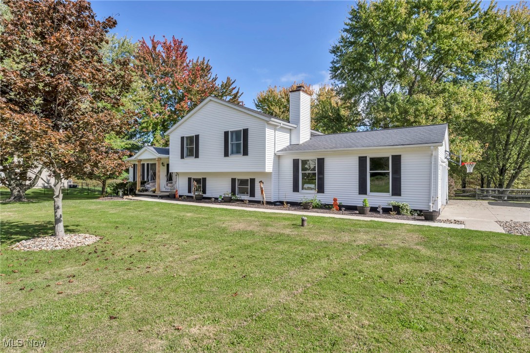18945 Thorpe Road Chagrin Falls, OH 44023 - Photo 2 of 35 Split level home featuring a chimney and a front yard