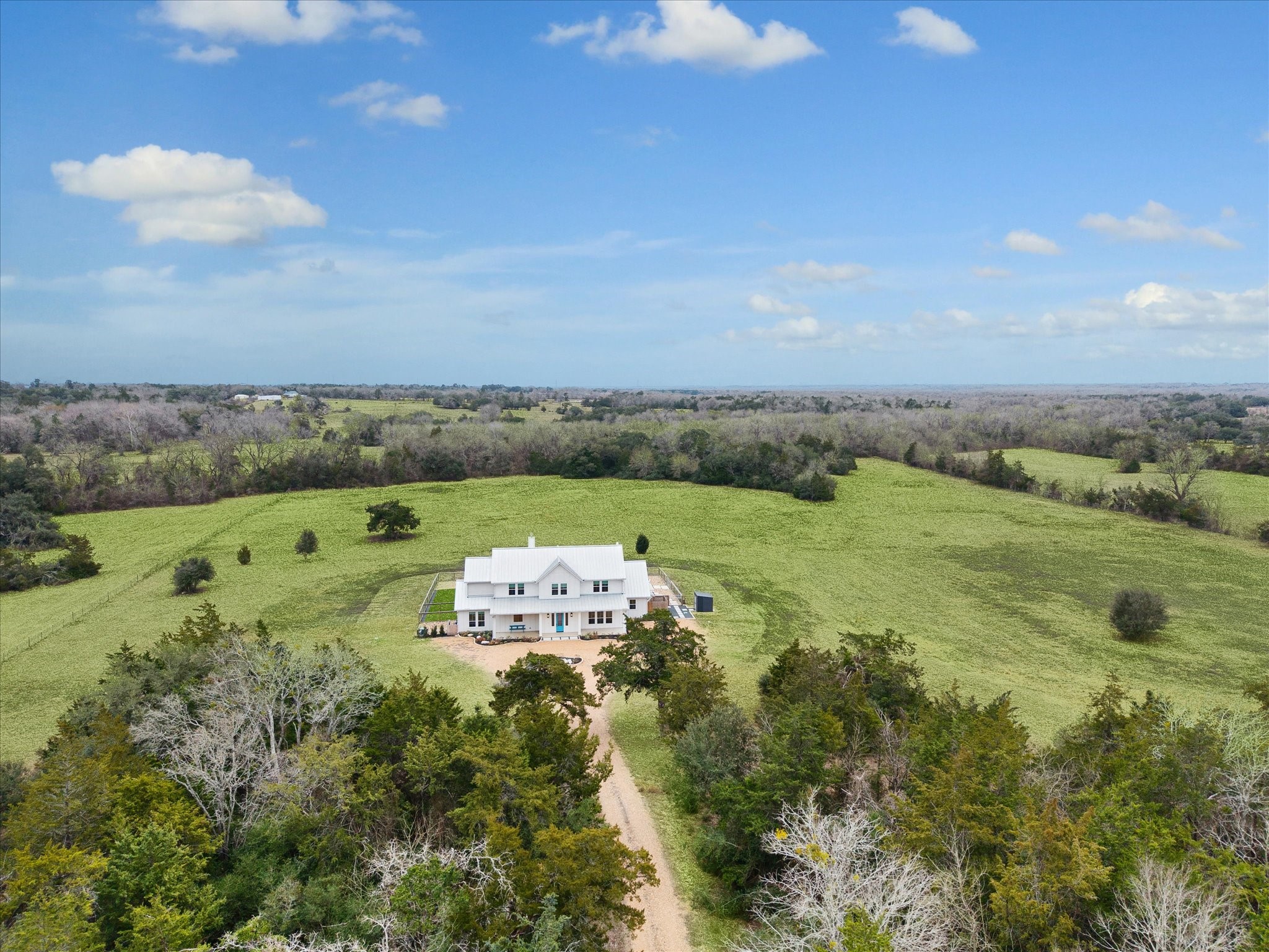 13167 Fm 389 Road Burton, TX 77835 - Photo 1 of 49 an aerial view of a houses with outdoor space and trees all around