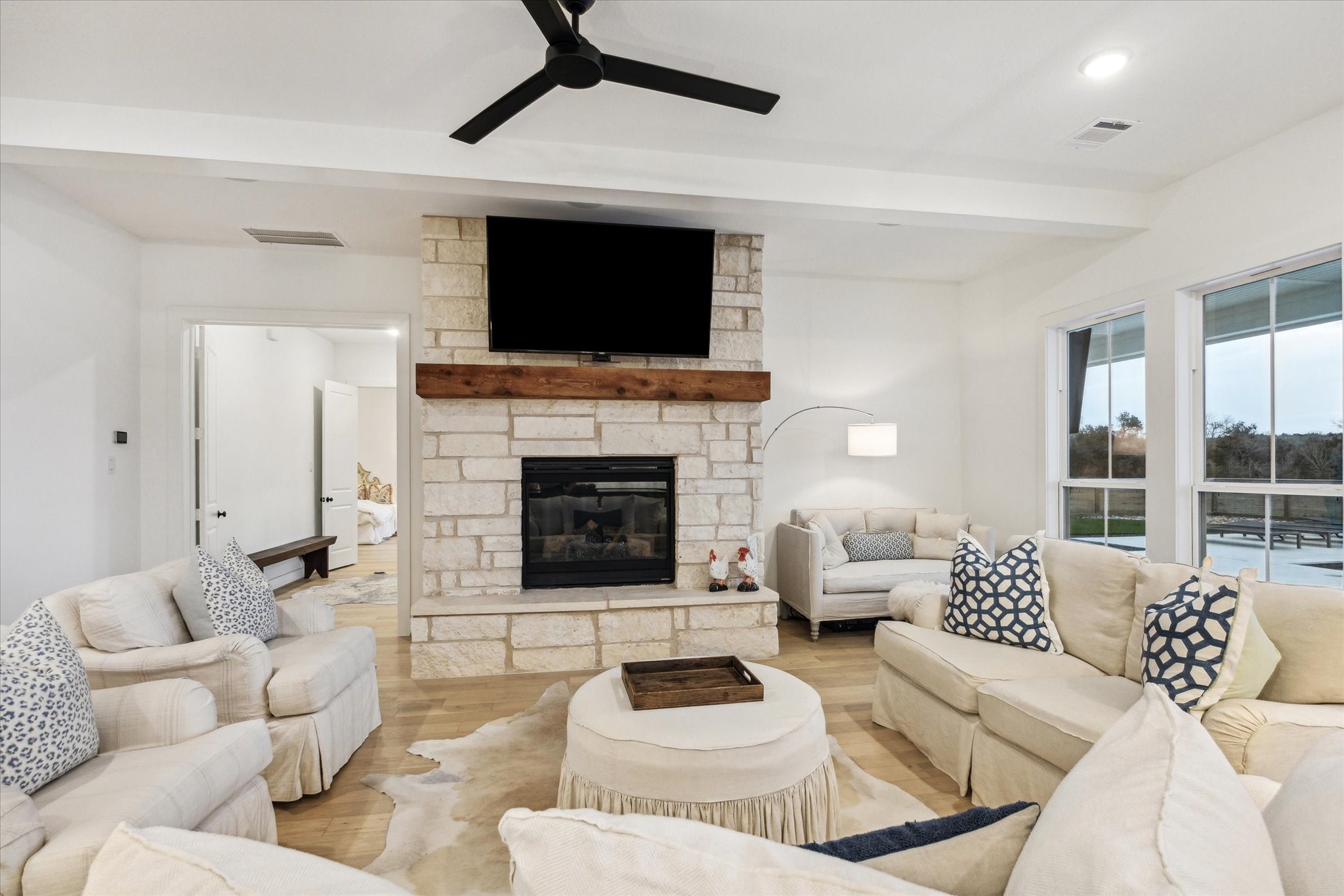 13167 Fm 389 Road Burton, TX 77835 - Photo 14 of 49 a living room with furniture a flat screen tv and a fireplace