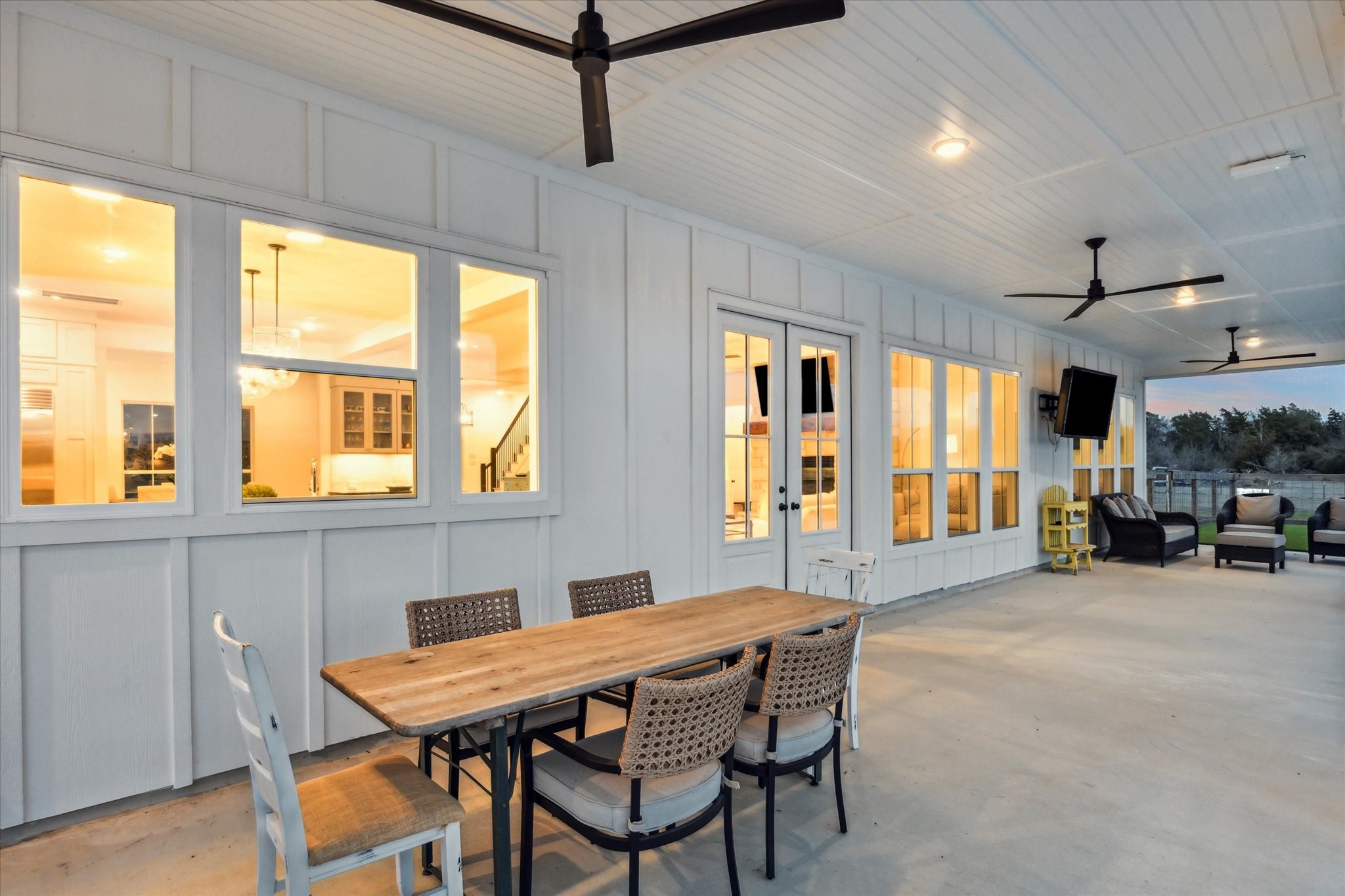 13167 Fm 389 Road Burton, TX 77835 - Photo 22 of 49 a view of a dining room with furniture large windows and wooden floor