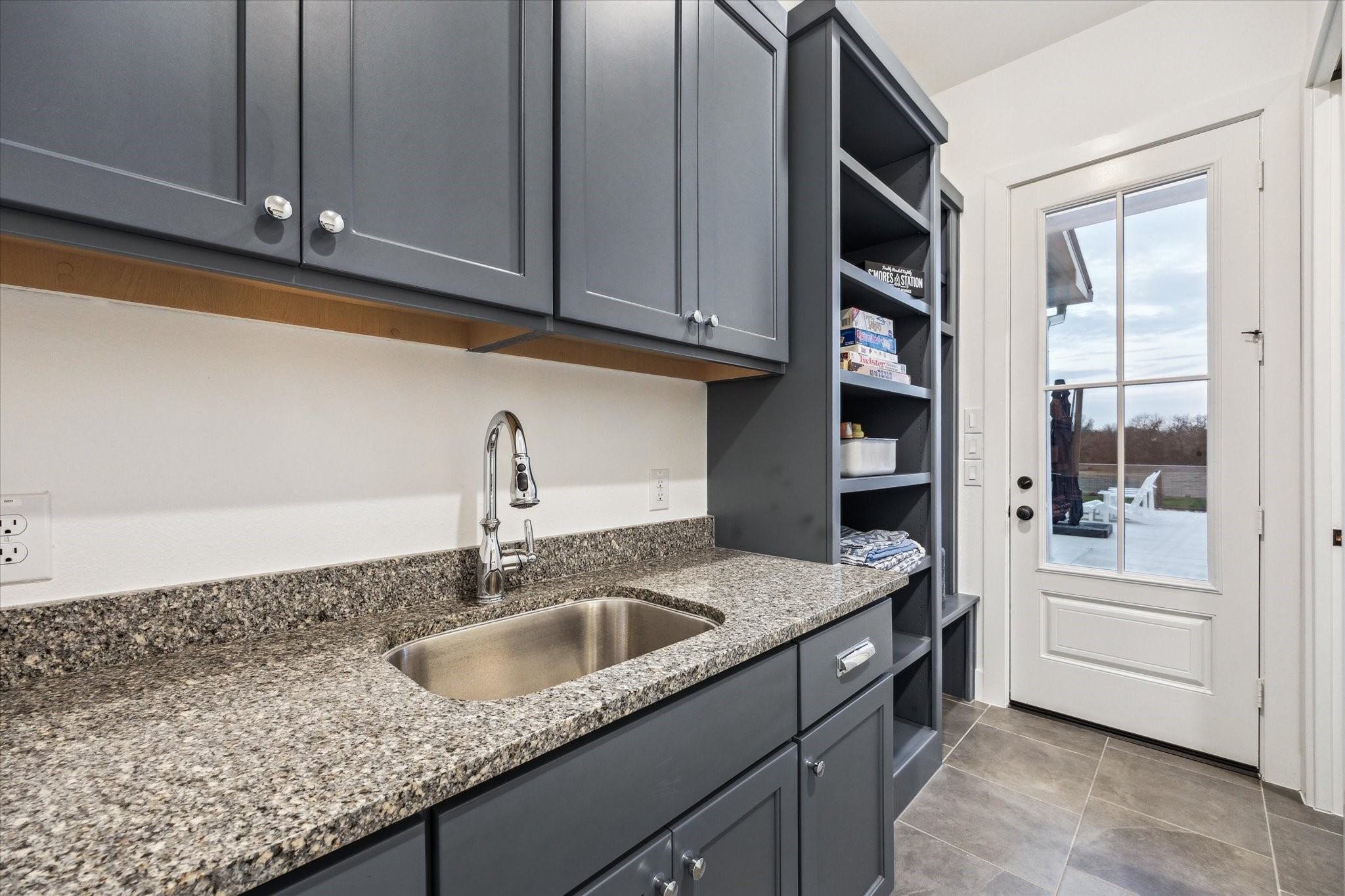 13167 Fm 389 Road Burton, TX 77835 - Photo 41 of 49 a kitchen with stainless steel appliances granite countertop a sink and dishwasher with wooden floor
