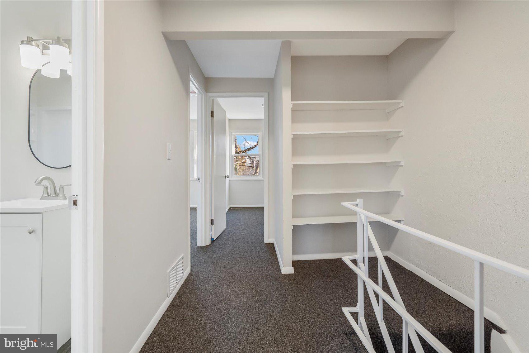 4322 Annapolis Road Baltimore, MD 21227 - Photo 15 of 28 a view of walk in closet with empty racks
