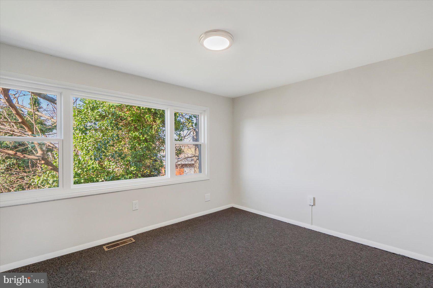 4322 Annapolis Road Baltimore, MD 21227 - Photo 17 of 28 an empty room with windows