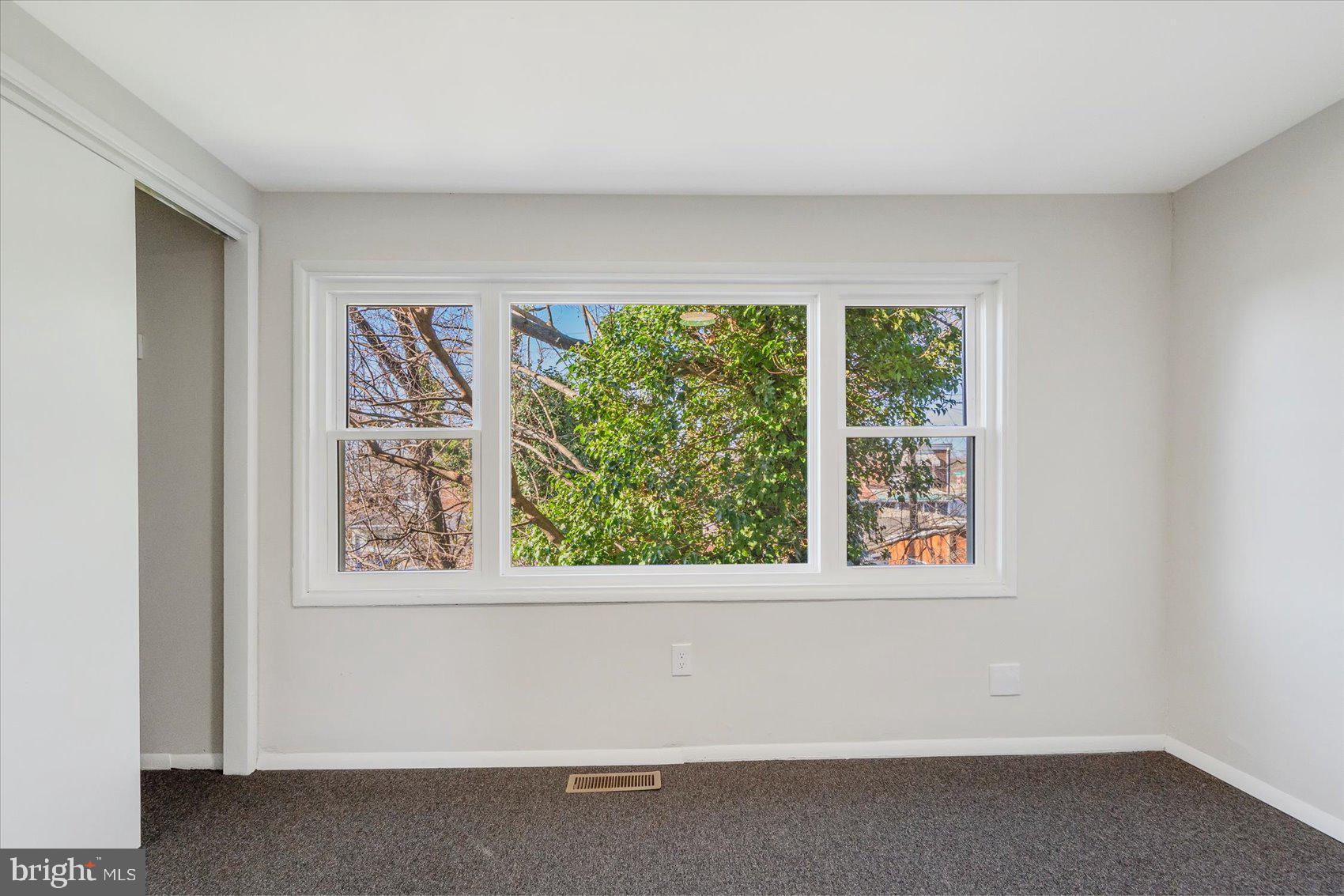 4322 Annapolis Road Baltimore, MD 21227 - Photo 18 of 28 an empty room with a window