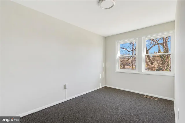 a view of room with window and closet