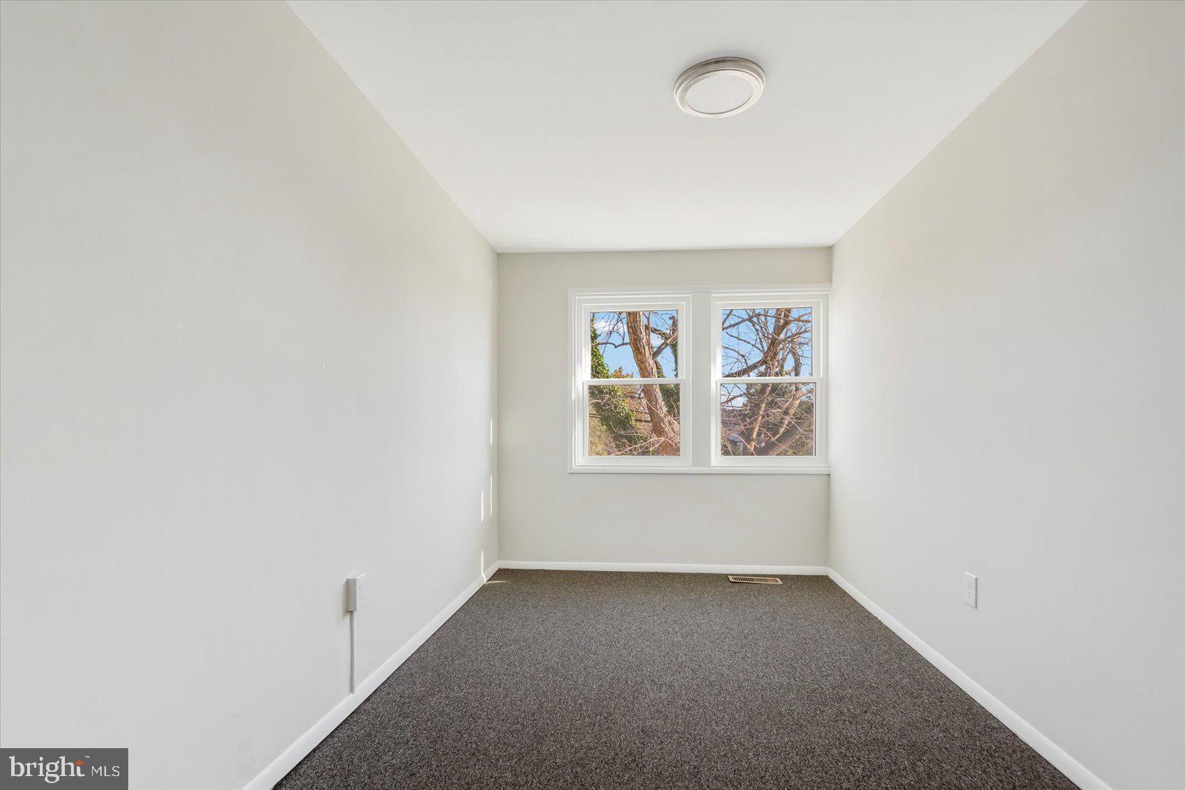 4322 Annapolis Road Baltimore, MD 21227 - Photo 24 of 28 an empty room with windows