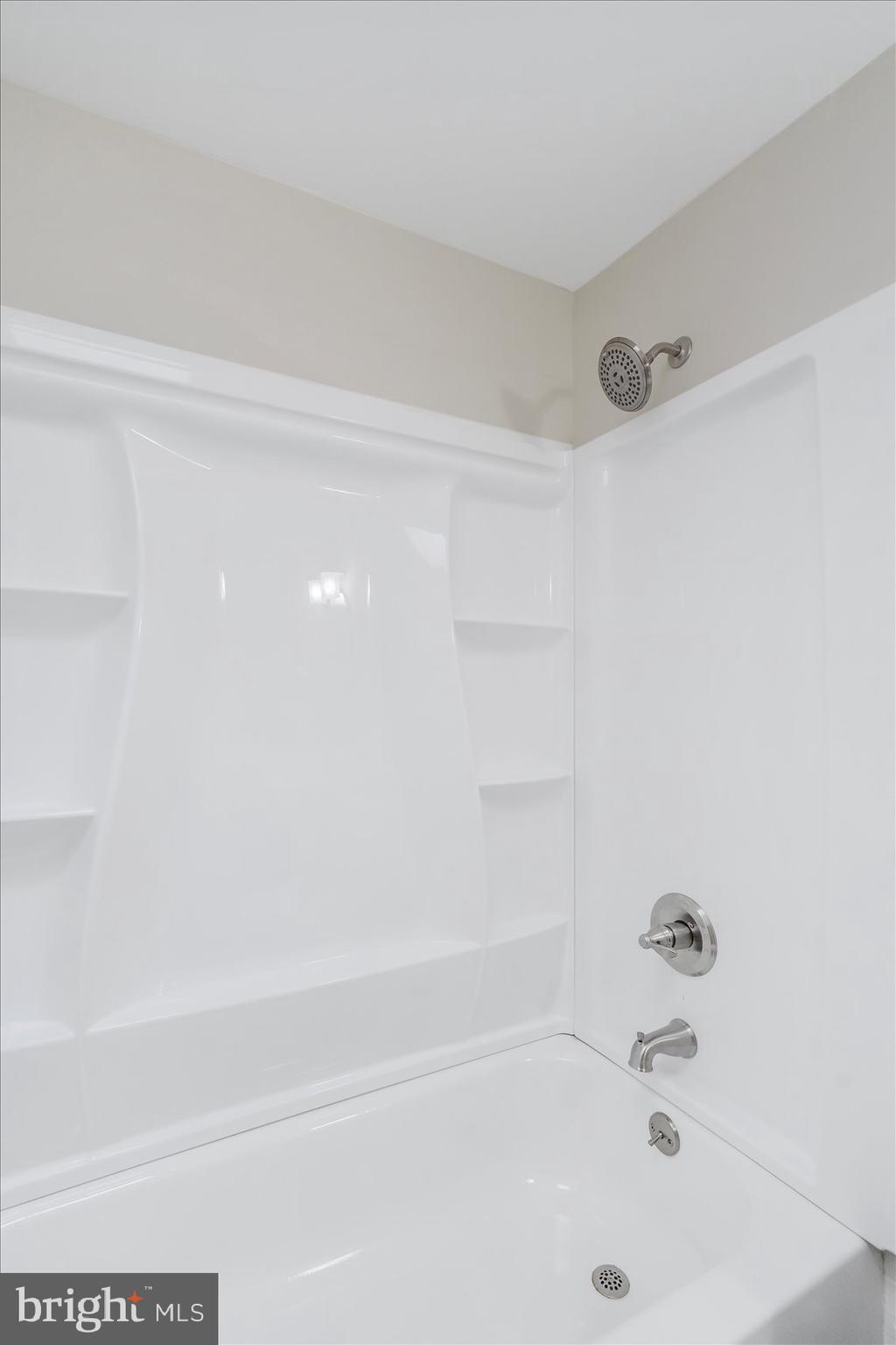 4322 Annapolis Road Baltimore, MD 21227 - Photo 28 of 28 a bathroom with a bathtub