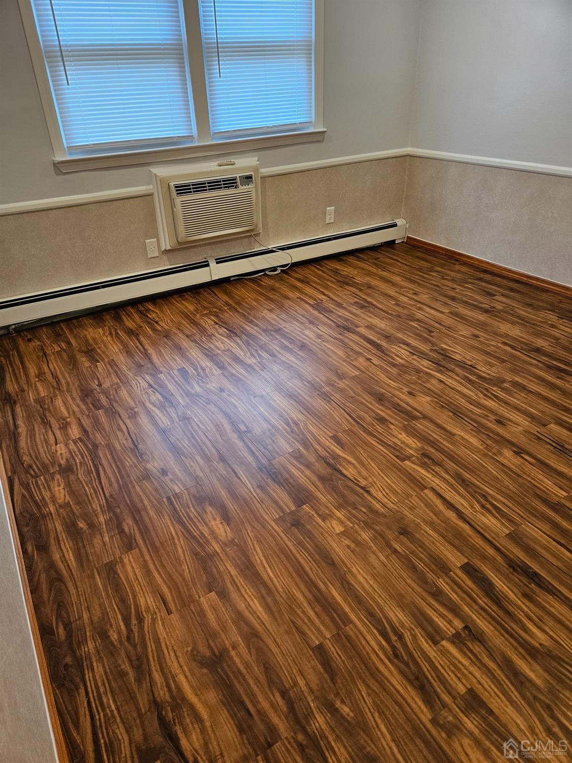 420 Cross Road, Unit 11 Matawan, NJ 07747 - Photo 13 of 15 a view of a room with wooden floor and cabinet