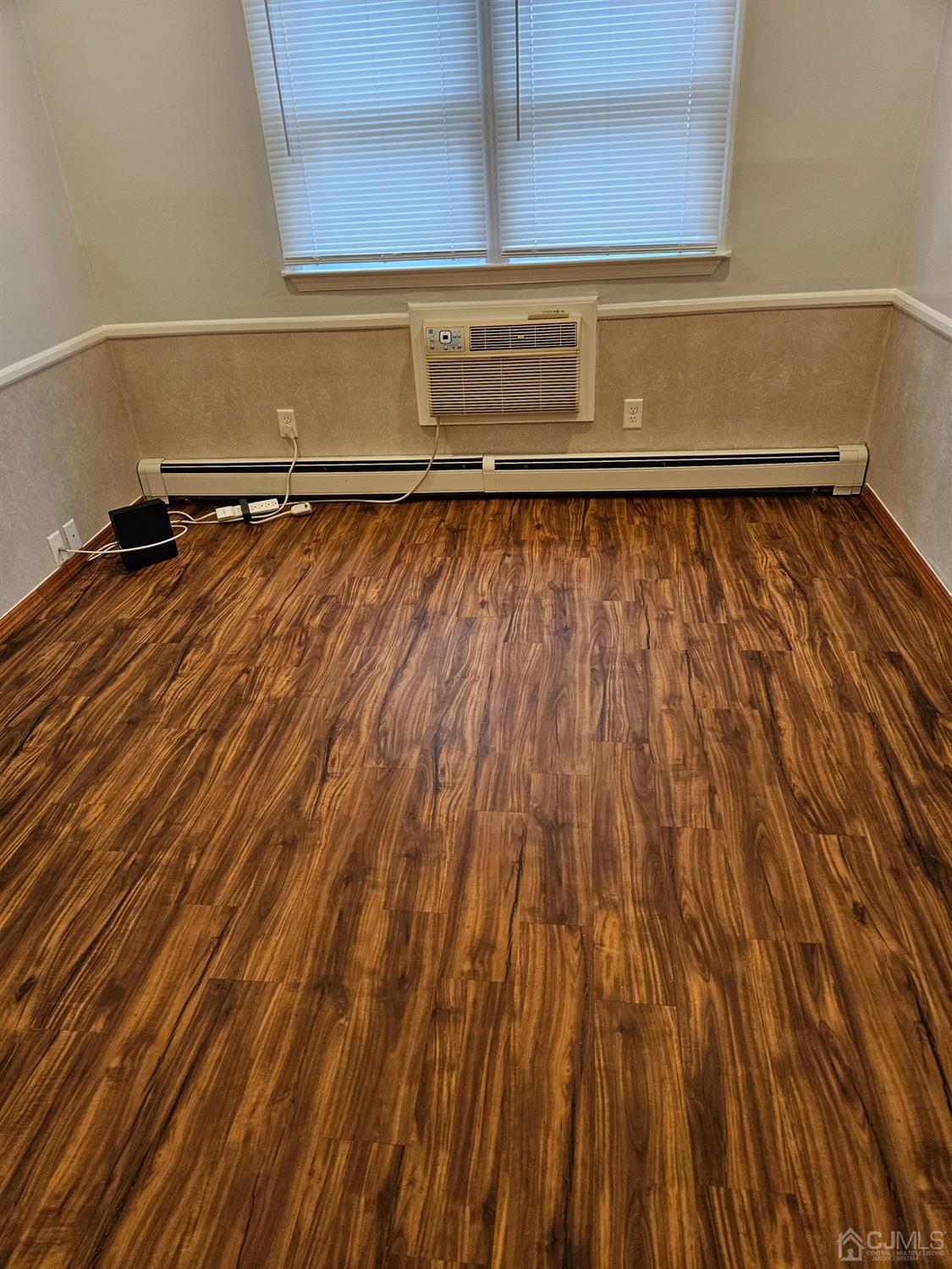 420 Cross Road, Unit 11 Matawan, NJ 07747 - Photo 14 of 15 a view of storage and utility room with wooden floor