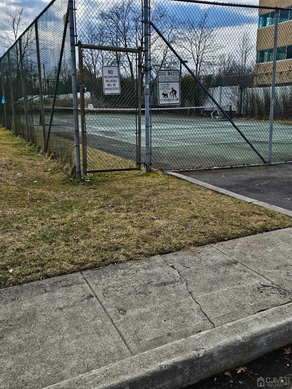 420 Cross Road, Unit 11 Matawan, NJ 07747 - Photo 15 of 15 a view of a backyard of the house