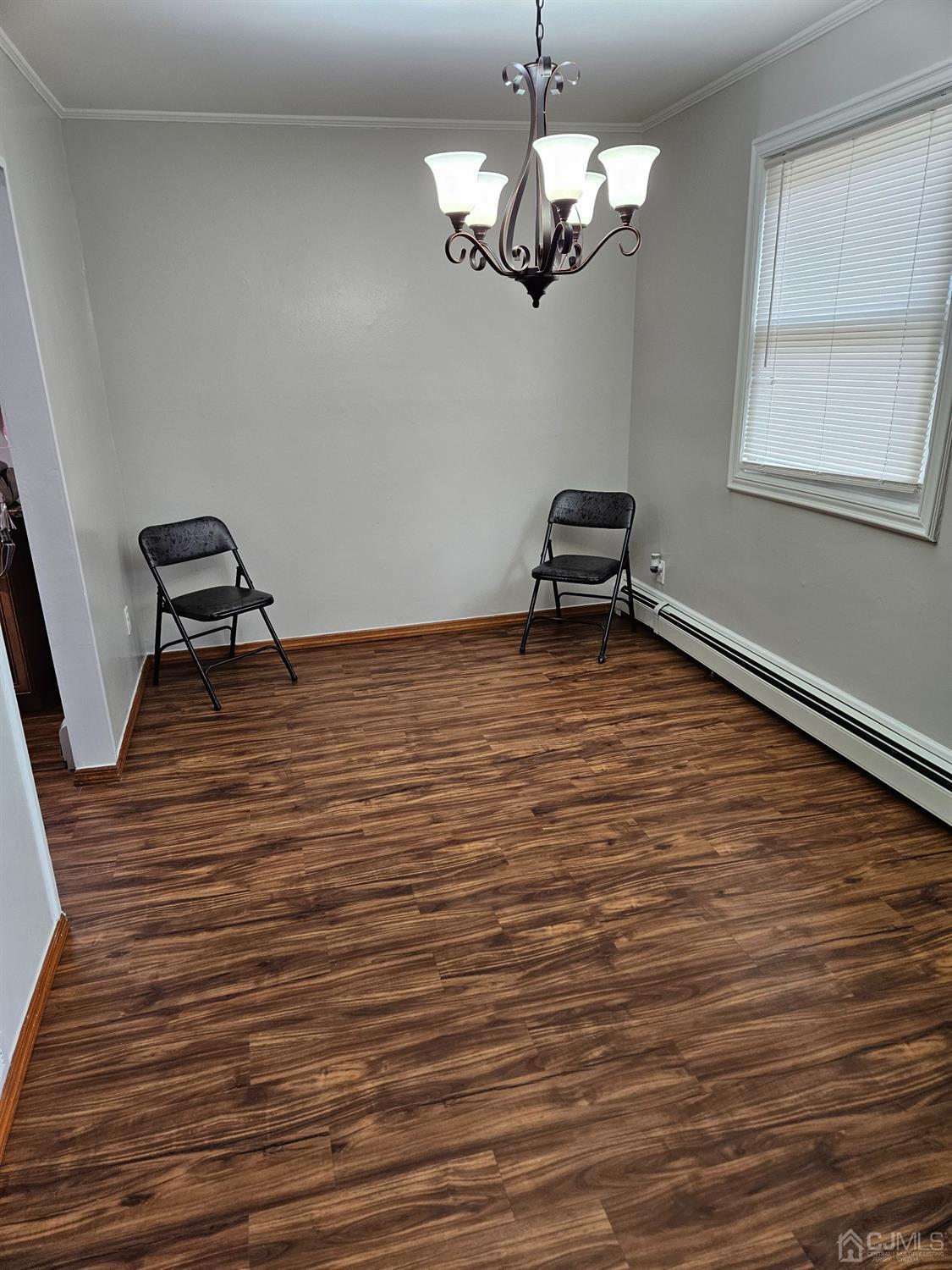 420 Cross Road, Unit 11 Matawan, NJ 07747 - Photo 6 of 15 a view of a room with wooden floor and a window