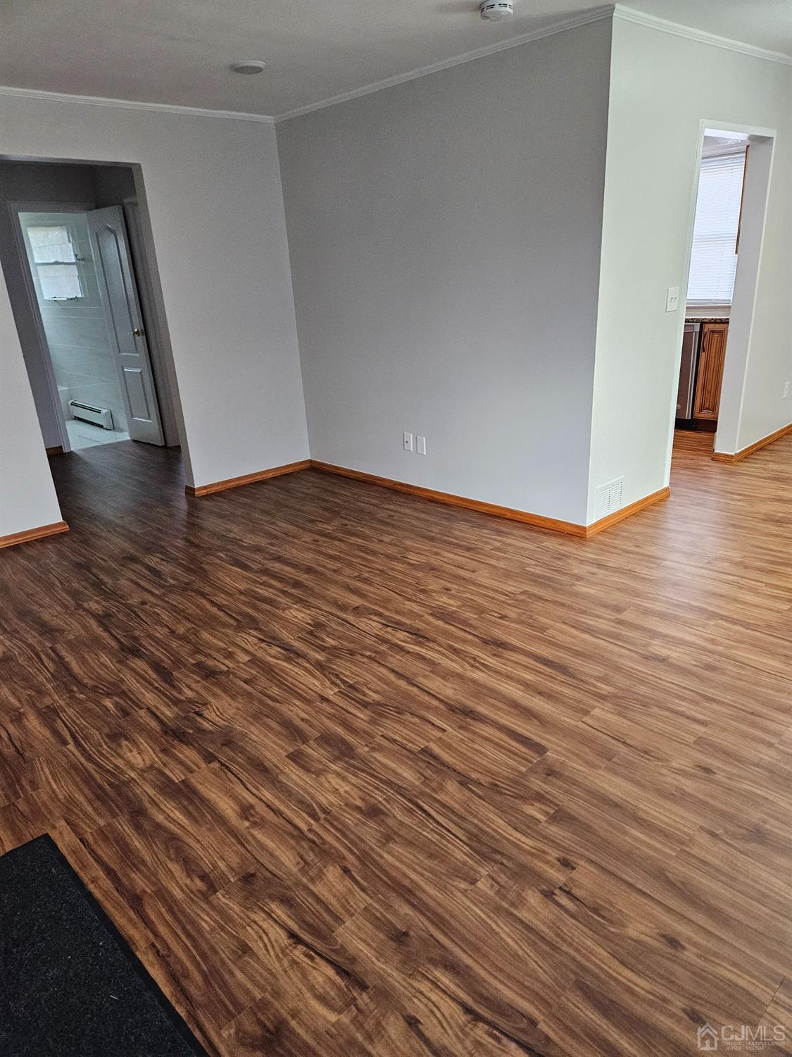 420 Cross Road, Unit 11 Matawan, NJ 07747 - Photo 7 of 15 a view of empty room with wooden floor