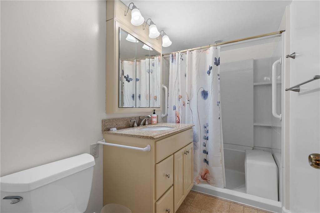 1500 Cochran Road, Unit 412 Pittsburgh, PA 15243 - Photo 23 of 45 a bathroom with a sink a toilet and shower