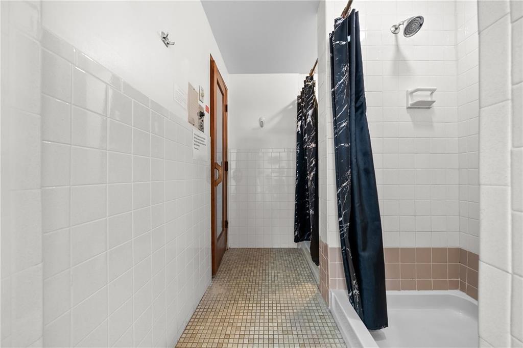 1500 Cochran Road, Unit 412 Pittsburgh, PA 15243 - Photo 34 of 45 a view of hallway with stairs and a shower