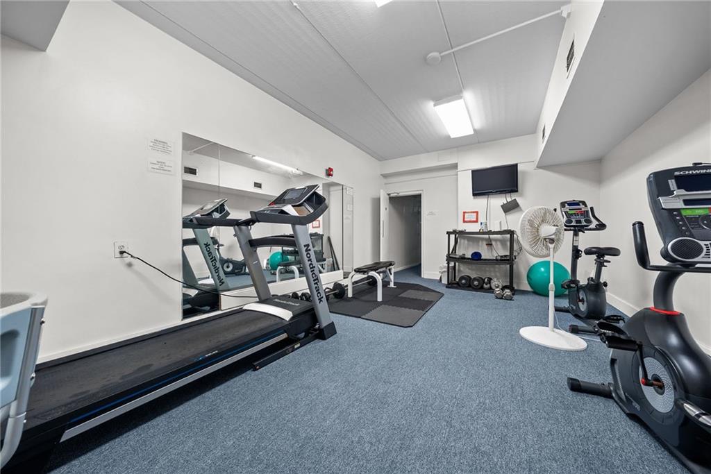 1500 Cochran Road, Unit 412 Pittsburgh, PA 15243 - Photo 36 of 45 a room with gym equipment and a table