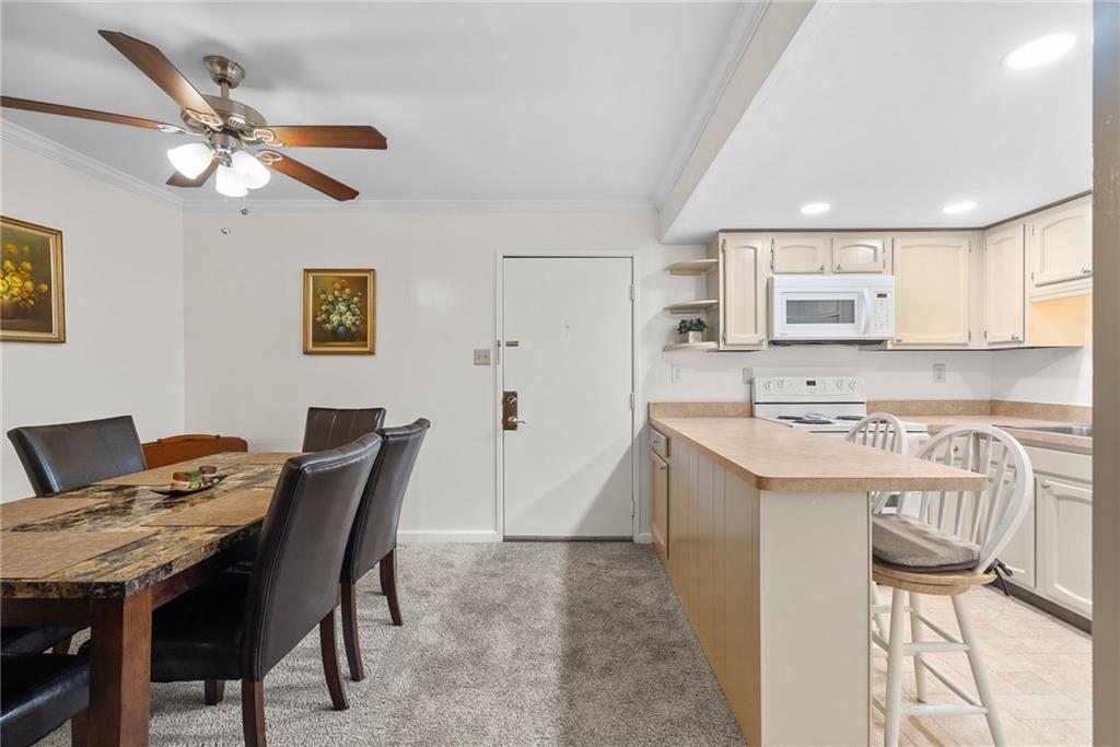 1500 Cochran Road, Unit 412 Pittsburgh, PA 15243 - Photo 8 of 45 a view of a dining room with furniture