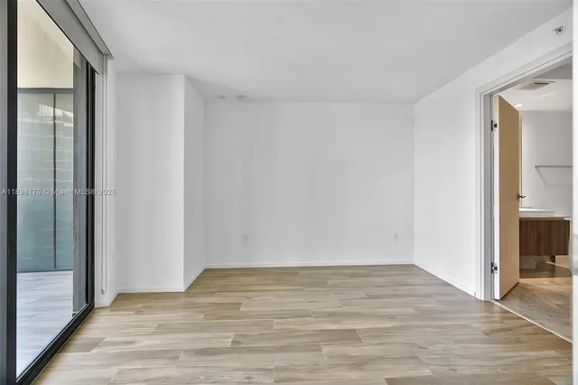 a view of entryway with wooden floor