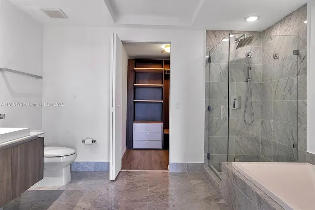 a bathroom with a bathtub and a shower