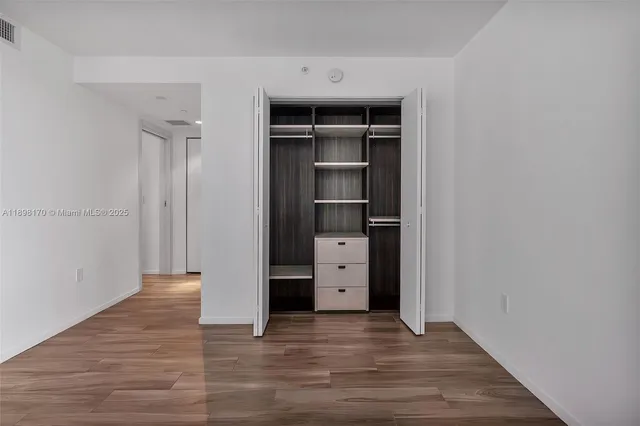 a view of an empty walk in closet