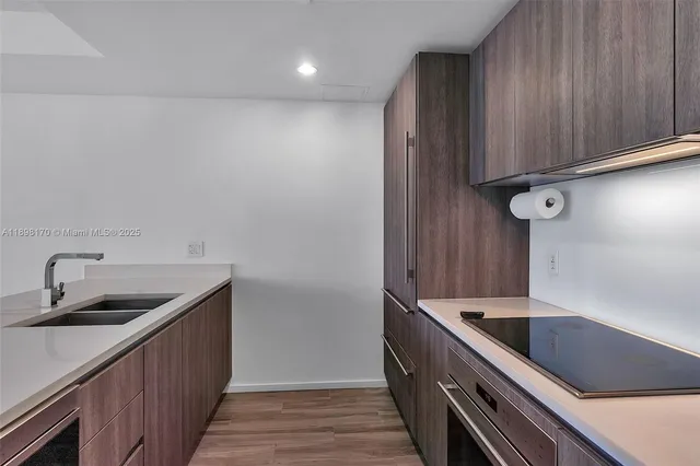 a view of water heater room with windows