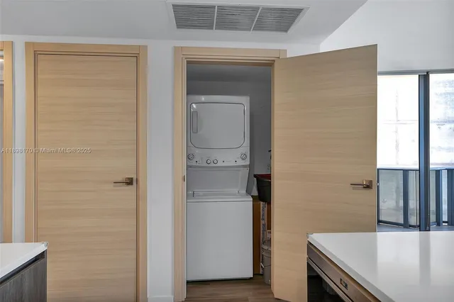 a kitchen with stainless steel appliances a sink and a refrigerator