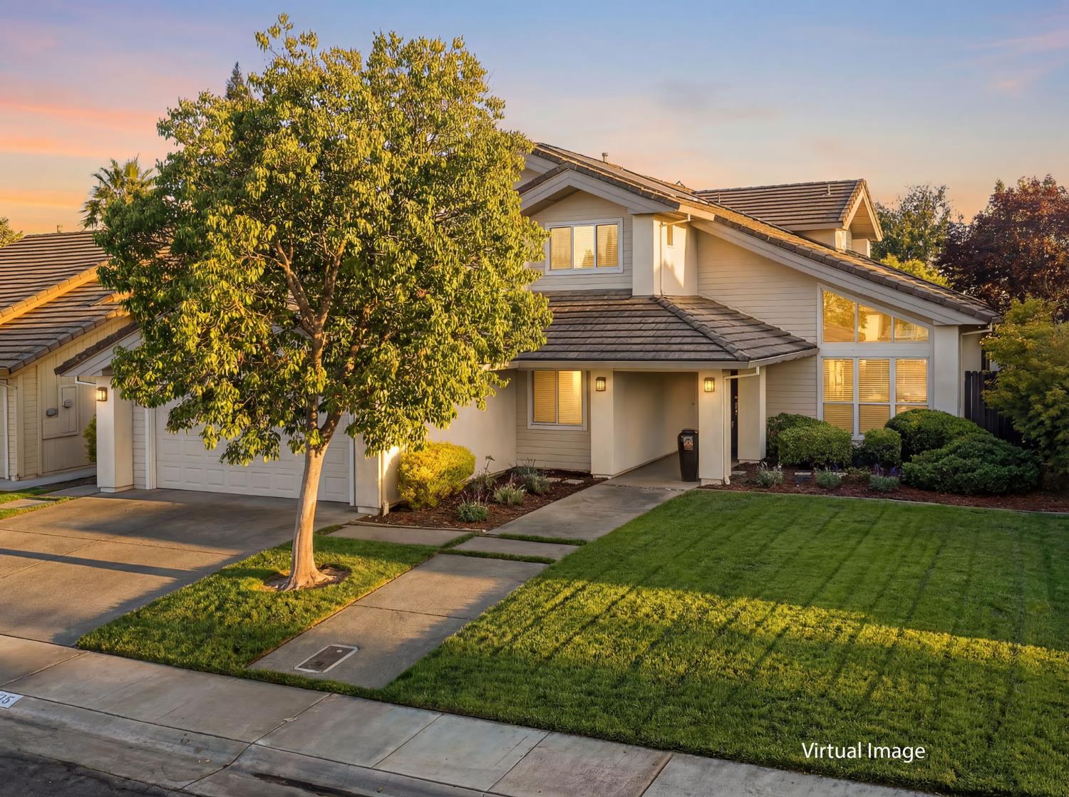 416 Merganser Place Davis, CA 95616 - Photo 1 of 46 a front view of a house with garden