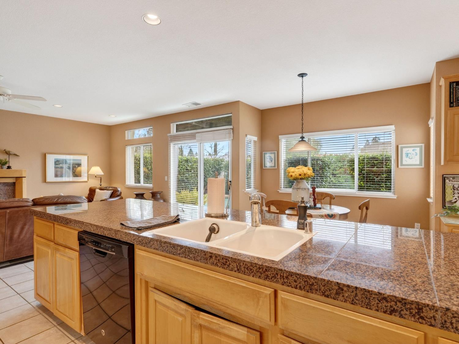 416 Merganser Place Davis, CA 95616 - Photo 15 of 46 a dining hall with stainless steel appliances granite countertop a sink counter space and a large window