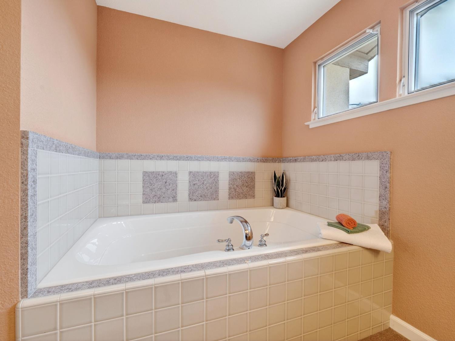 416 Merganser Place Davis, CA 95616 - Photo 25 of 46 a white bath tub sitting in a bathroom