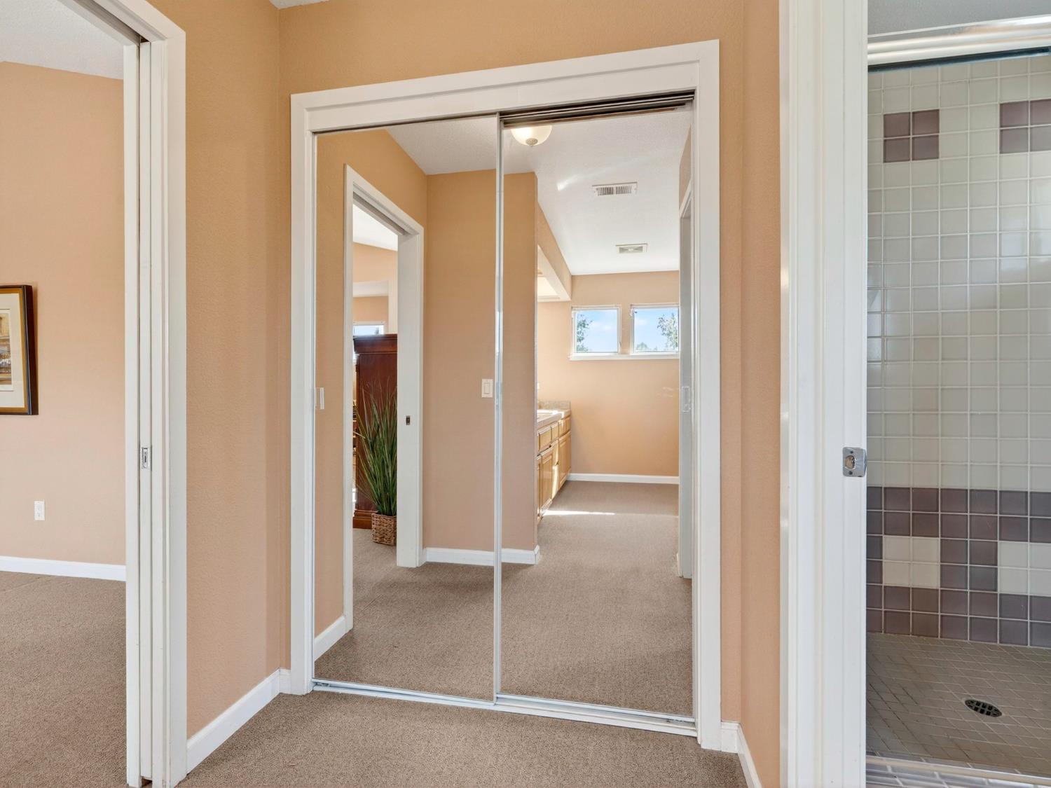 416 Merganser Place Davis, CA 95616 - Photo 28 of 46 a view of a bathroom from a hallway with a glass door