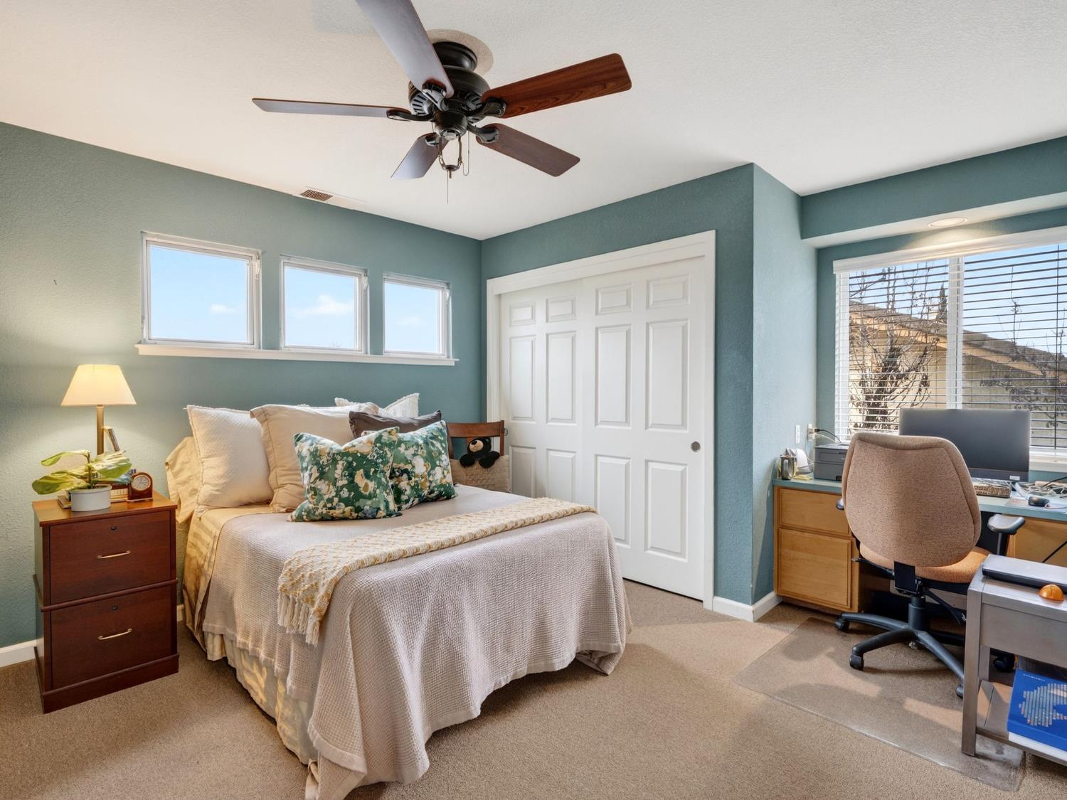 416 Merganser Place Davis, CA 95616 - Photo 30 of 46 a bedroom with a bed a chair and a large window