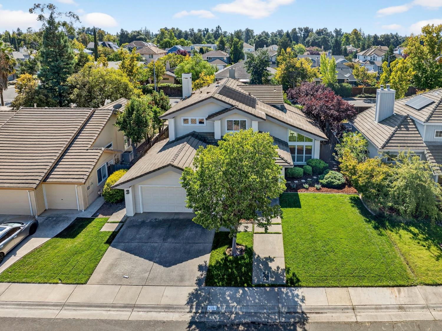 416 Merganser Place Davis, CA 95616 - Photo 41 of 46 a house that has a tree in front of it