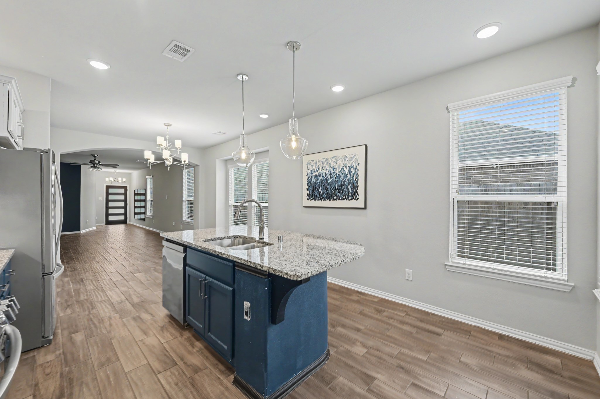 29836 Woodsons Edge Way Spring, TX 77386 - Photo 12 of 38 Easy flow between the kitchen, dining, and living spaces for everyday living and entertaining.