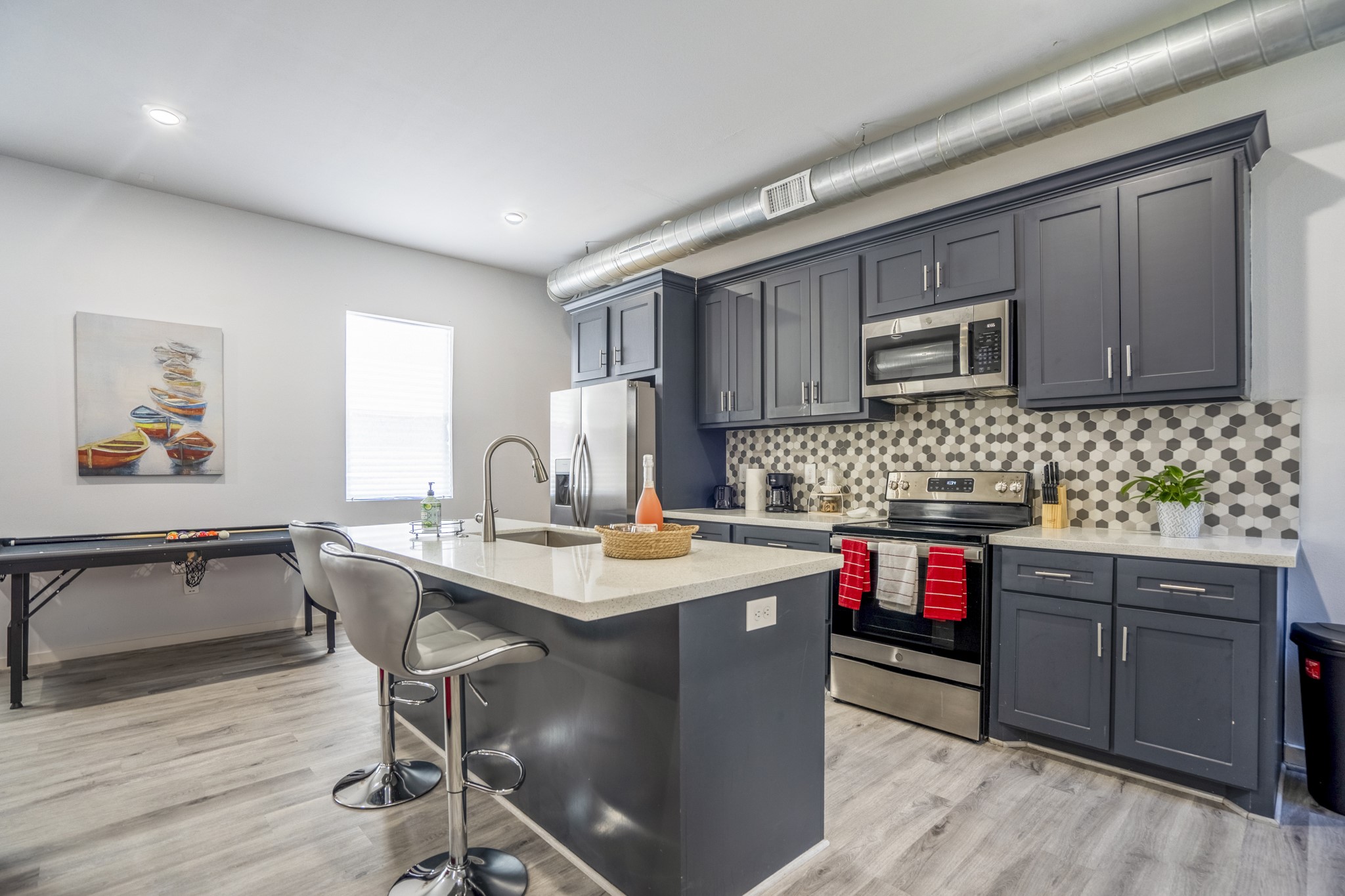 2518 Cleburne Street Houston, TX 77004 - Photo 20 of 24 a kitchen with stainless steel appliances granite countertop a stove top oven a sink dishwasher and cabinets with wooden floor