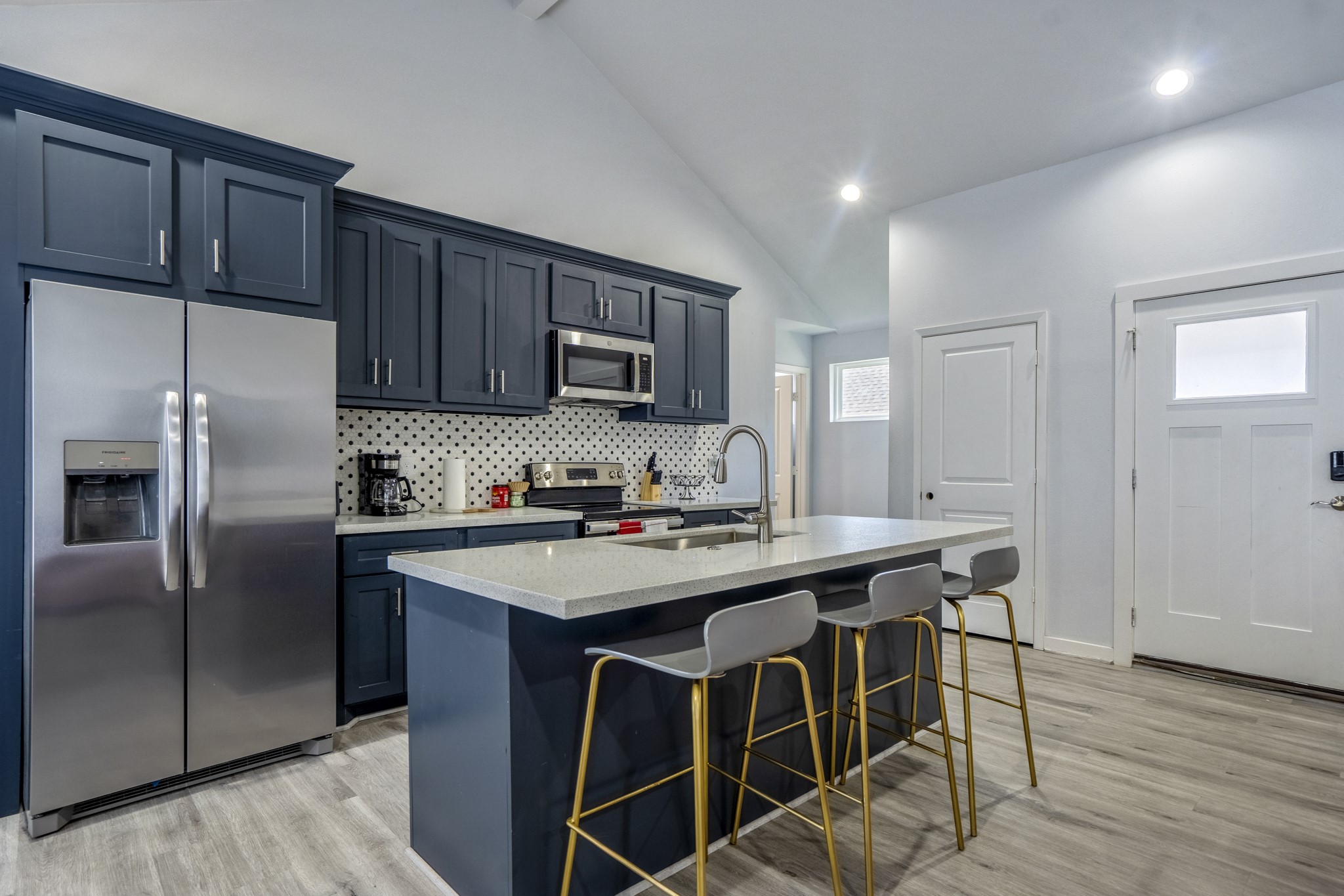 2518 Cleburne Street Houston, TX 77004 - Photo 9 of 24 a kitchen with stainless steel appliances a sink a stove a refrigerator and cabinets