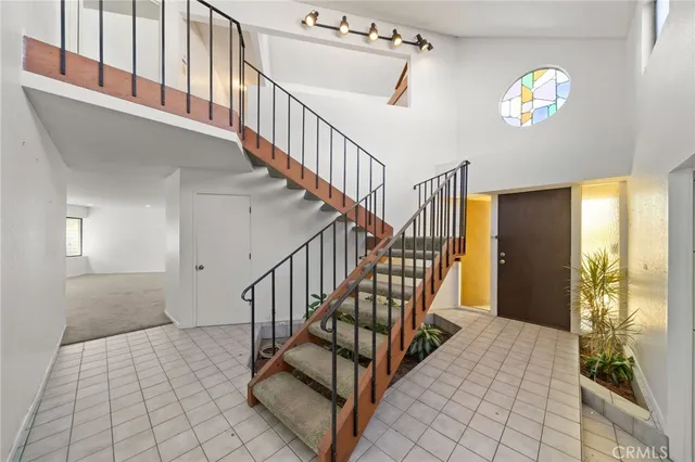 a living room with furniture and large window