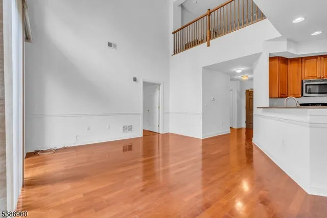 a view of a kitchen with a sink and a refrigerator