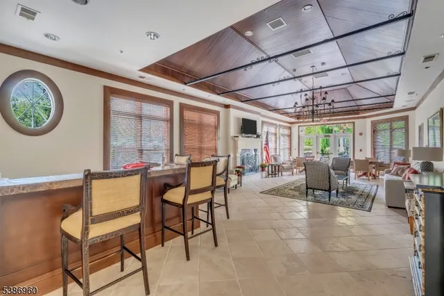 a living room with furniture a large window with outer view