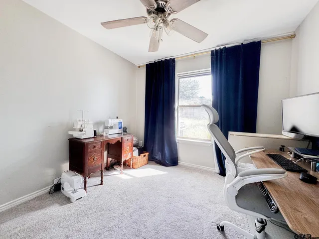 a view of a workspace with furniture