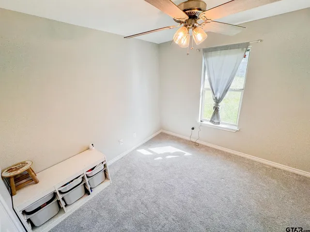 a bathroom with a toilet a sink and a mirror