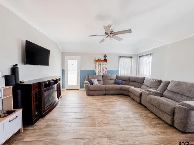 a living room with furniture and a flat screen tv