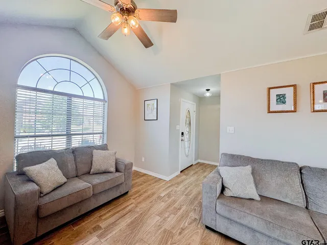 a living room with furniture and a large window
