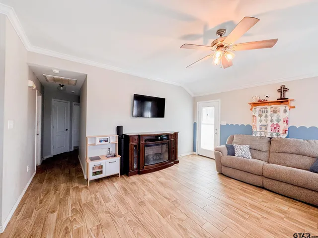 a living room with furniture and a flat screen tv